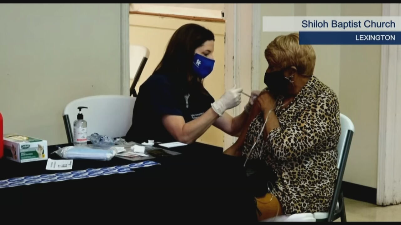 A woman receives the COVID-19 vaccine in Lexington